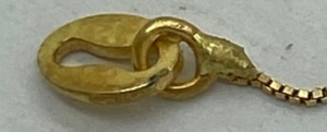 Esempio di catenina in oro giallo saldata esteticamente aberrante con fiamma